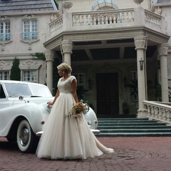 1950 Austin Princess Limousine — Princess Ivy — parked at a Utah wedding venue at golden hour